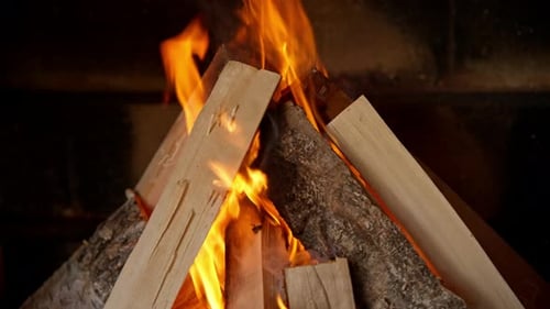 Burning Fireplace Logs with Bright Orange Flames