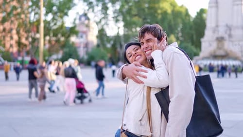 Loving Couple Embraces in an Urban City Center