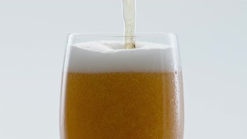 Cold Craft Beer Pouring to Glass in Super Slow Motion Close Up