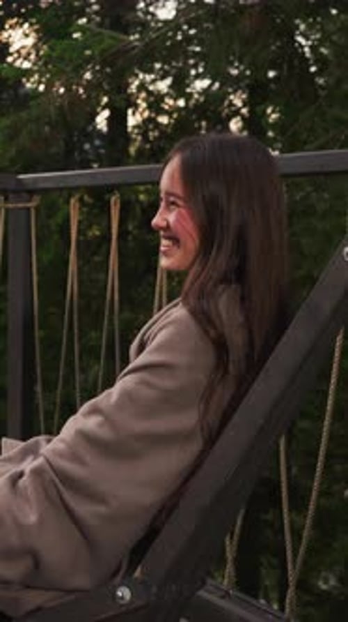 Couple Laughs Together on Hotel Terrace