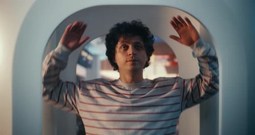 Young Male Passenger Standing in Full Body Scanner at Airport Security Check