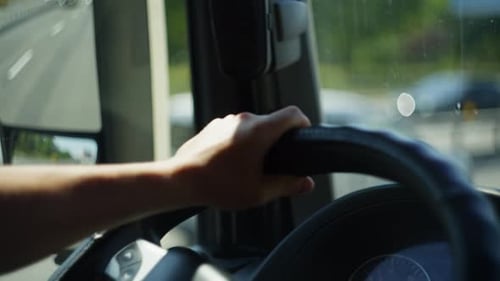 Truck Driver Hands at the Wheel CloseUp View of Steering During LongDistans