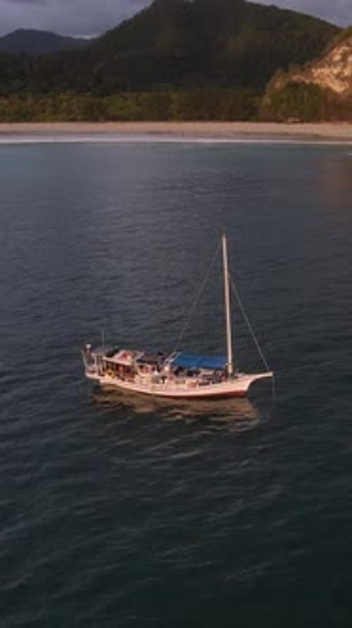 Small Sailing Boat in the Sea Near the Coast