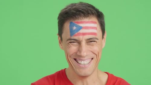 Adult Smiling with Flag Painted on Forehead