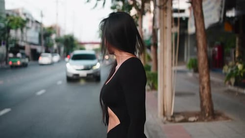 Confident Fitness Woman Walking on a Busy City Street
