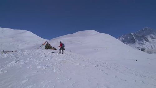 Aerial Circular Close Up View Caucasian Male Hiker on Trekking Trail Way with Poles Walk By Tilicho