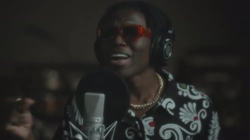 African American Singer Performing Expressively in Music Recording Studio