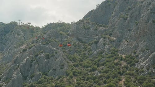 Cable car, red funiculars carry people up and down the mountain. Bottom view