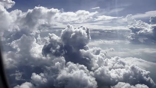 Airplane Flight Wing of an Airplane Flying Above the Clouds with Sunset Sky View From the Window of