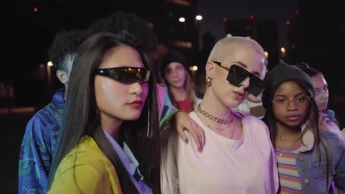 Stylish Young Adults Posing in Urban Night Scene