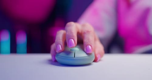 Close Up Hand Clicking Computer Mouse with Pink Nails
