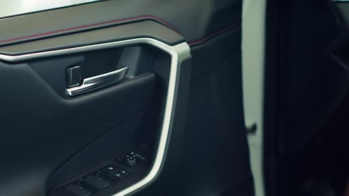 Close Up of Person Closing Car After Using Lock Controls on Panel to Unlock It