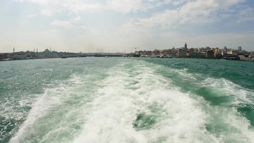 Panoramic View of Istanbul Skyline From a Boat with Foamy Waves