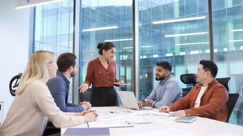 Diverse Team Collaborates in Modern Office Meeting