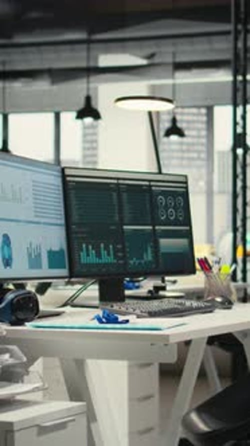 Vertical Video Empty Corporate Workstations with Computers Running Financial Diagnostics