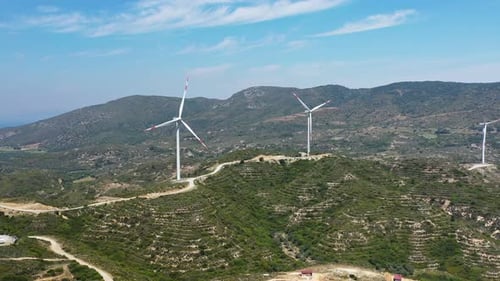 Wind Turbines Spinning on a Picturesque Mountain Scenery