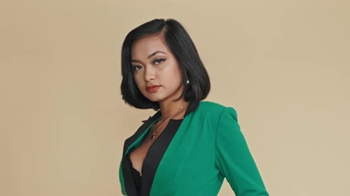 Seductive Asian Model Posing on Camera in Studio