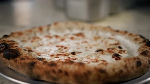 Hot delicious pizza 4 cheeses in the restaurant ready to serve - traditional italian cuisine