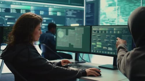 Team Collaborates on Cybersecurity in Bright Modern Office