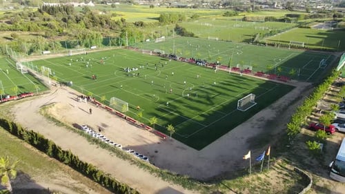 Aerial View of Soccer Game on Green Field