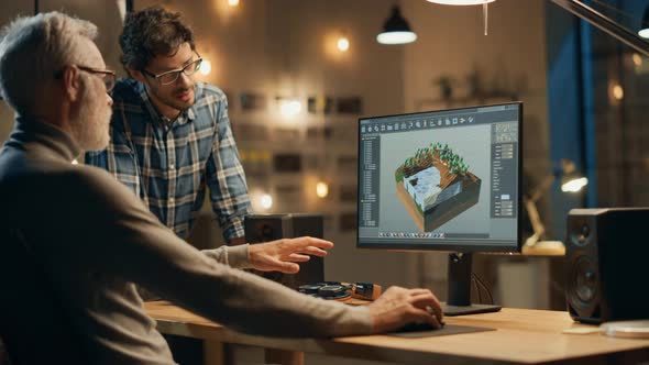 In the Evening Creative Middle Aged Video Game Developer Works on a ...