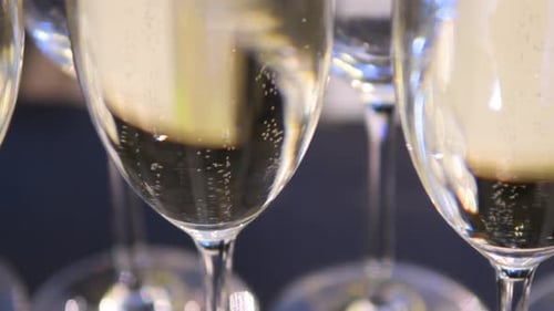 Close up, champagne in wine glasses. a sparkling wine with bubbles.