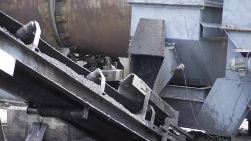 Industrial Conveyor Belt Transporting Small Stones