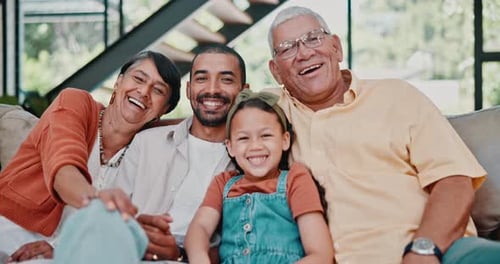 Happy Family Bonding at Home on Sofa