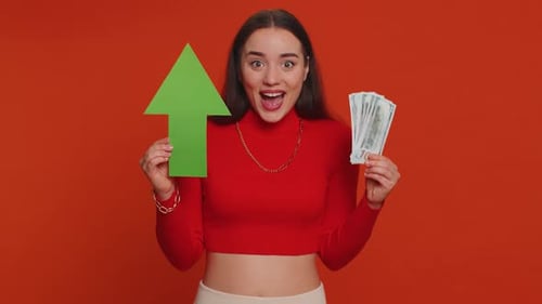 Excited Woman Holds Cash and Upward Arrow