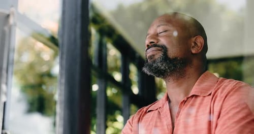 Window, smile and thinking with black man in home for memory, vision or mindset with view