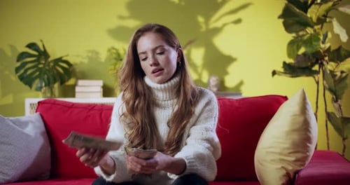 Young Redhaired Business Woman Receiving Salary Counting Cash Money Rejecting Low Profits Showing