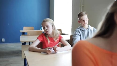 Students Listen Attentively in Classroom During Lesson