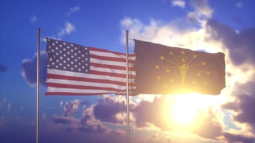 United States and Indiana Flags Waving at Sunset