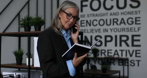 Professional Woman Talking on Phone in Office