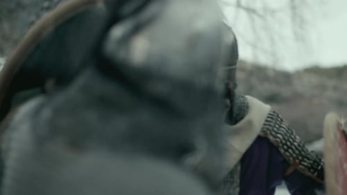 Armored Warriors Engaged in Intense Sword Combat