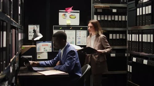 Law Officers Analyze Evidence in Office