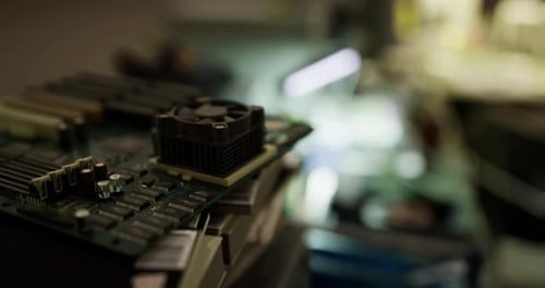 Close Up of a Computer Motherboard with Components on a Workbench