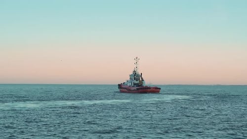 Fishing boat sailing on the baltic sea in Gdynia at the sunset