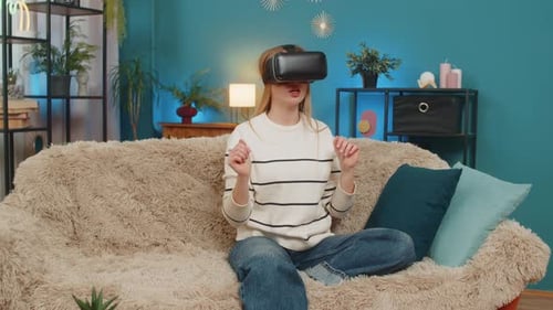 Woman Experiencing Virtual Reality on Couch at Home
