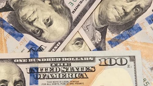 100 dollars Us banknotes, close up. Cash USD money background rotating. Concept of investment