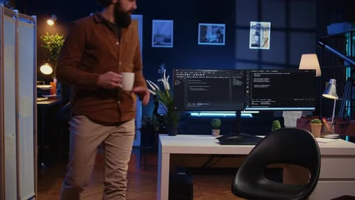 IT Specialist Begins Teleworking Job Shift Holding Cup of Tea