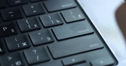 Close Up Male's Finger Aggressively Presses the Enter Key Several Times