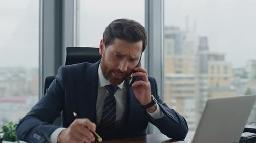 Irritated manager disputing on phone conversation in modern company office close up