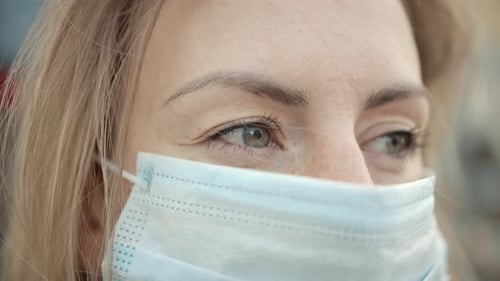 Close-Up Portrait of Modern Blonde Haired Young One Woman Wearing Protective Medical