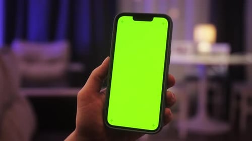 Woman Swiping Gesture on Chroma Key of Modern Smartphone Person Resting at Home and Using Smartphone