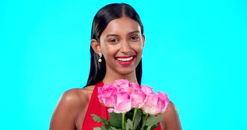 Joyful Woman with Roses on Blue Background