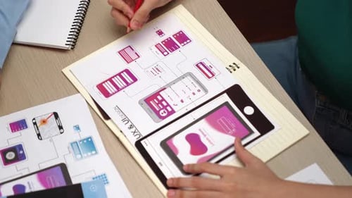 UX designers developing a user interface for mobile