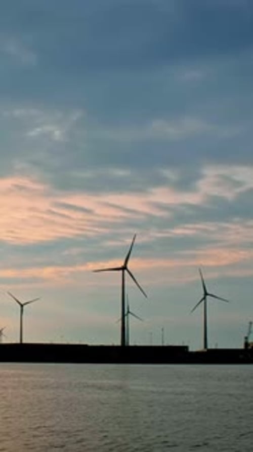 Wind Turbines in Antwerp Port on Sunset