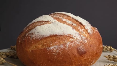 Crusty Loaf of Bread with Wheat Stalks