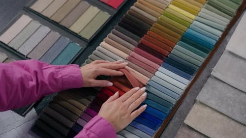 Woman Choosing Fabric Samples for Interior Design